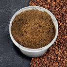 Sage & Stone Apothecary exfoliating anti-cellulite coffee scrub in a jar, natural body care product with coffee grounds for skin smoothing.