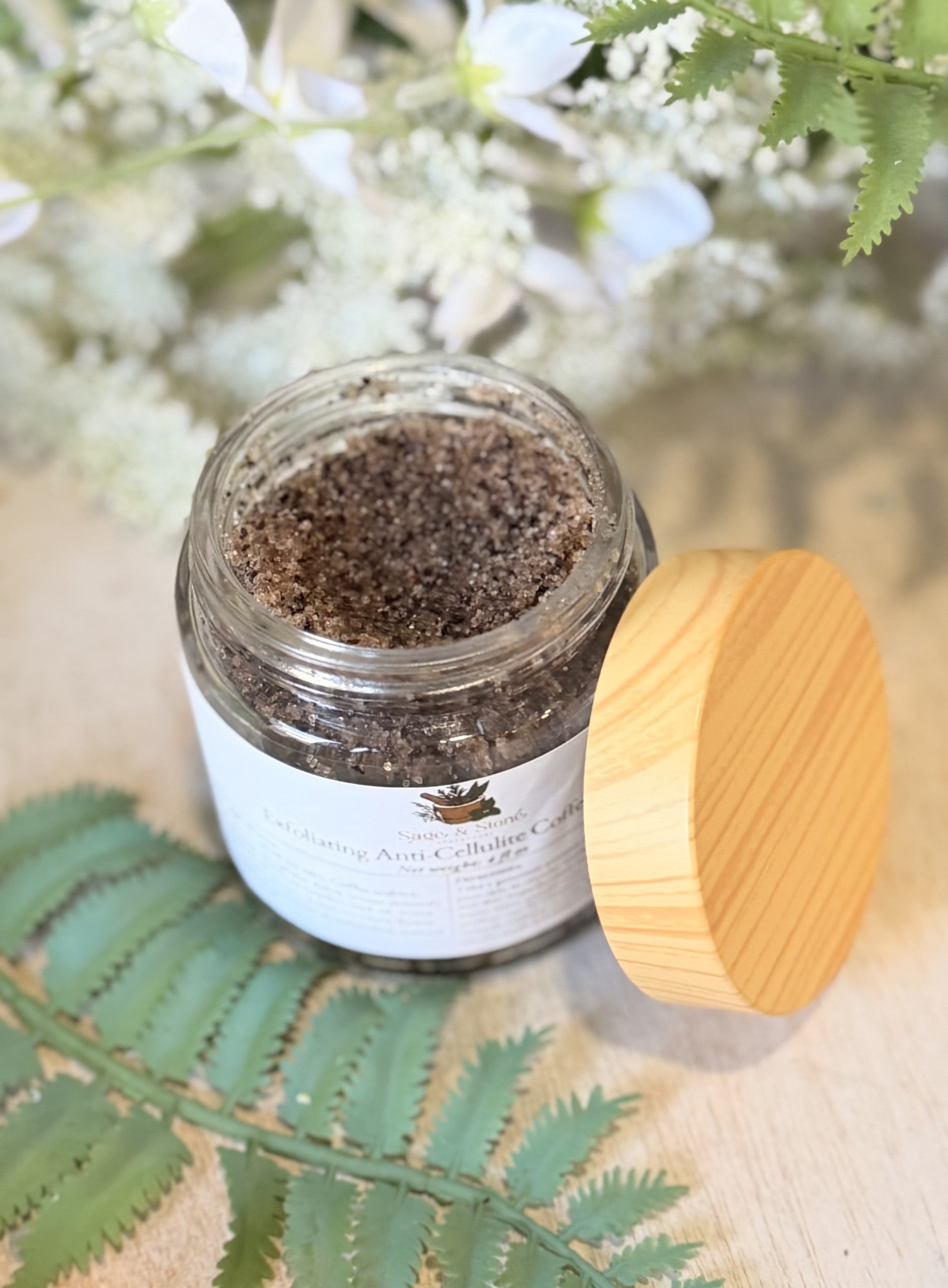 Sage & Stone Apothecary exfoliating anti-cellulite coffee scrub in a jar, natural body care product for skin smoothness and wellness.