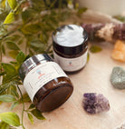 Sage & Stone Apothecary calcium bentonite clay mask for body care and wellness, showing the clay mask in a jar with a natural setting.
