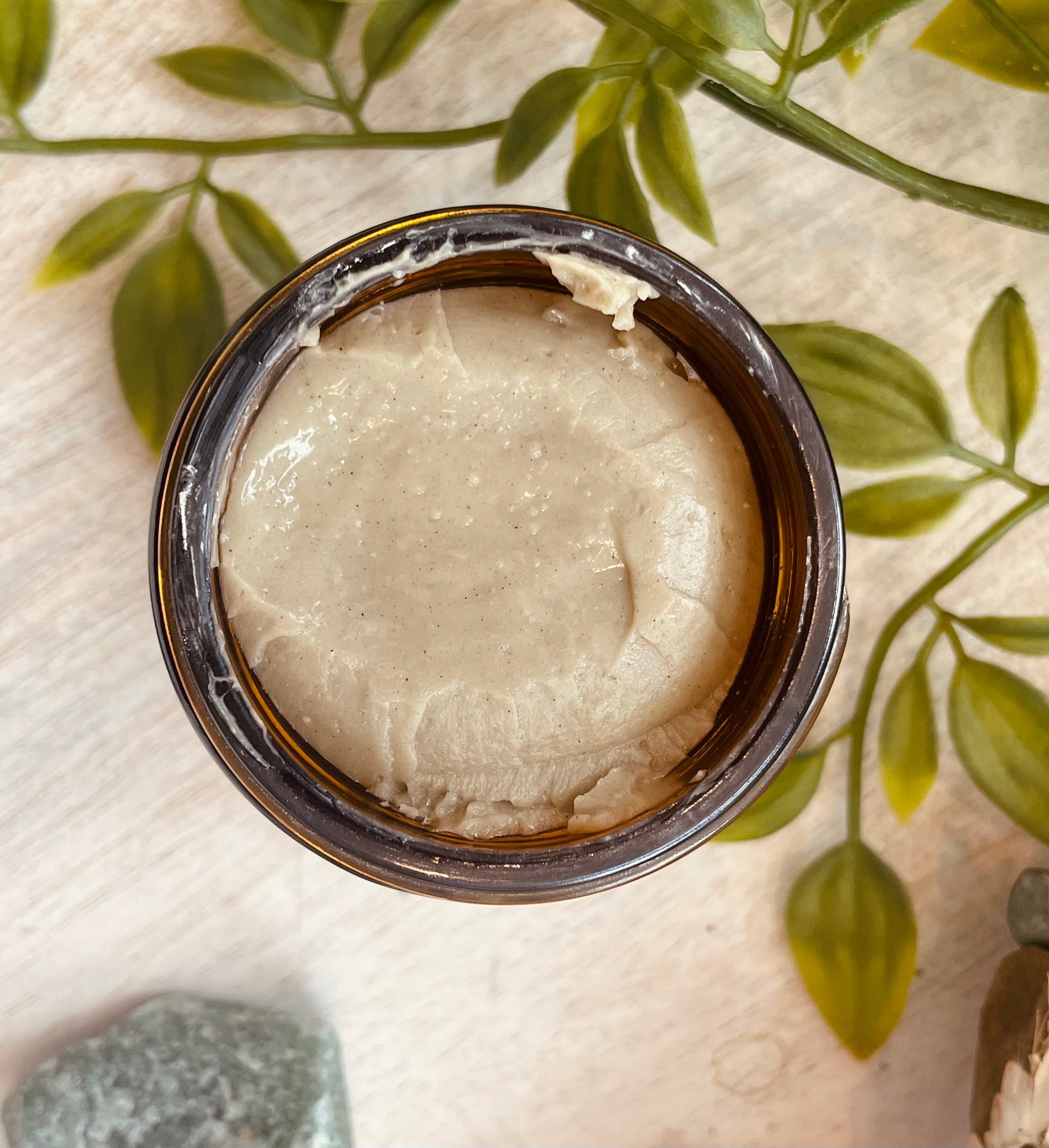 Sage & Stone Apothecary Calcium Bentonite Clay Mask for body care and wellness, showing the clay mask in a natural setting.