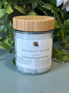 Sage & Stone Apothecary exfoliating Dead Sea salt scrub in a jar, showing the coarse salt texture for body care and wellness.