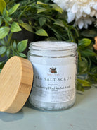 Sage & Stone Apothecary exfoliating Dead Sea salt scrub in a jar, showing textured salt and natural ingredients for body care.