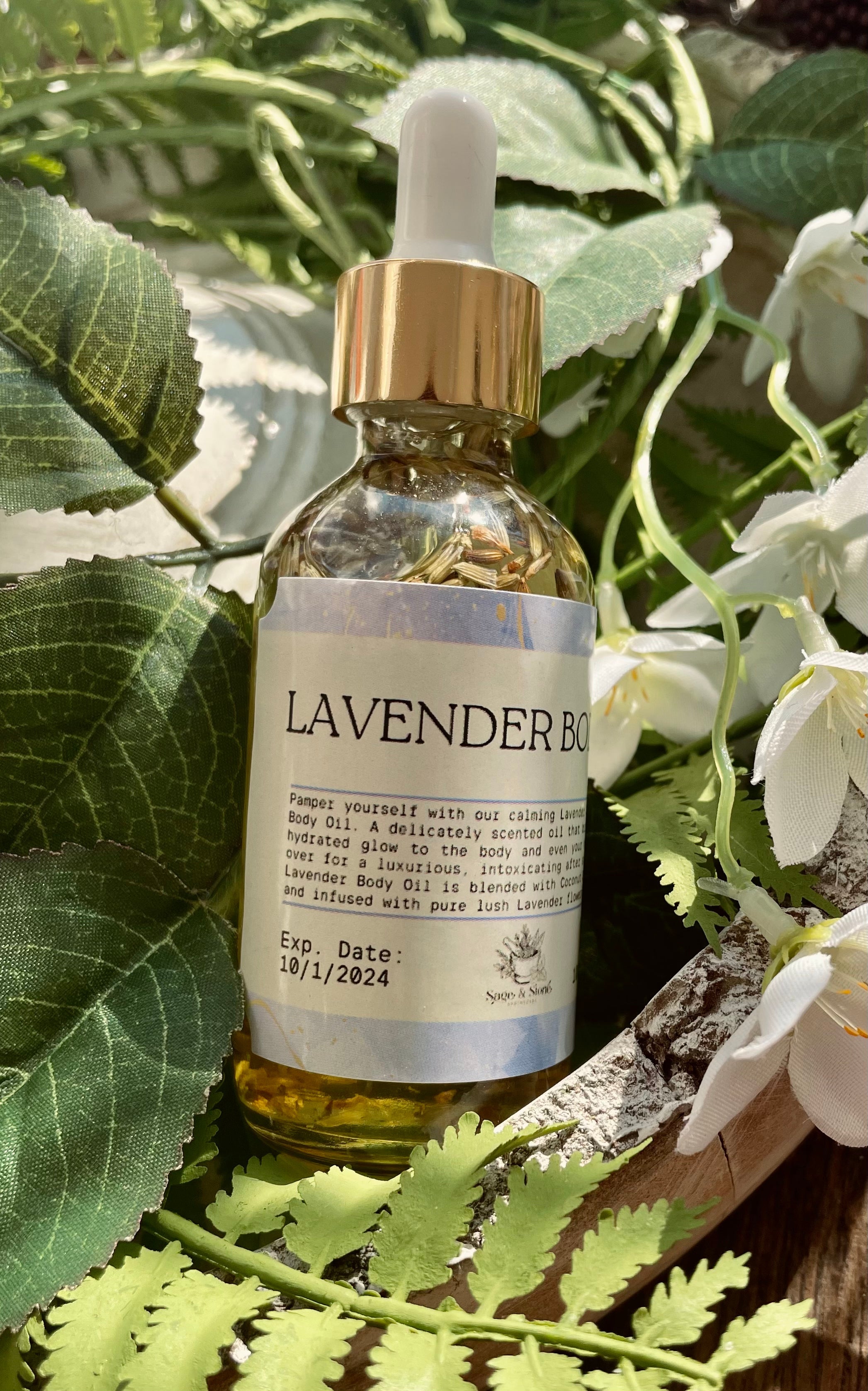Lavender body oil from Sage & Stone Apothecary, a natural body care and wellness product with a glass bottle and lavender accents.