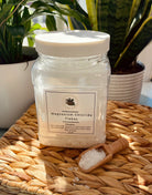 Sage & Stone Apothecary Magnesium Chloride Flakes for body care and wellness, shown in a clear, open container with flakes visible