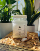 Sage & Stone Apothecary Magnesium Chloride Flakes for body care and wellness, showing white crystalline flakes in a jar.