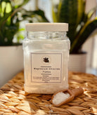 Sage & Stone Apothecary Magnesium Chloride Flakes for body care and wellness, shown in a clear container with a scoop.