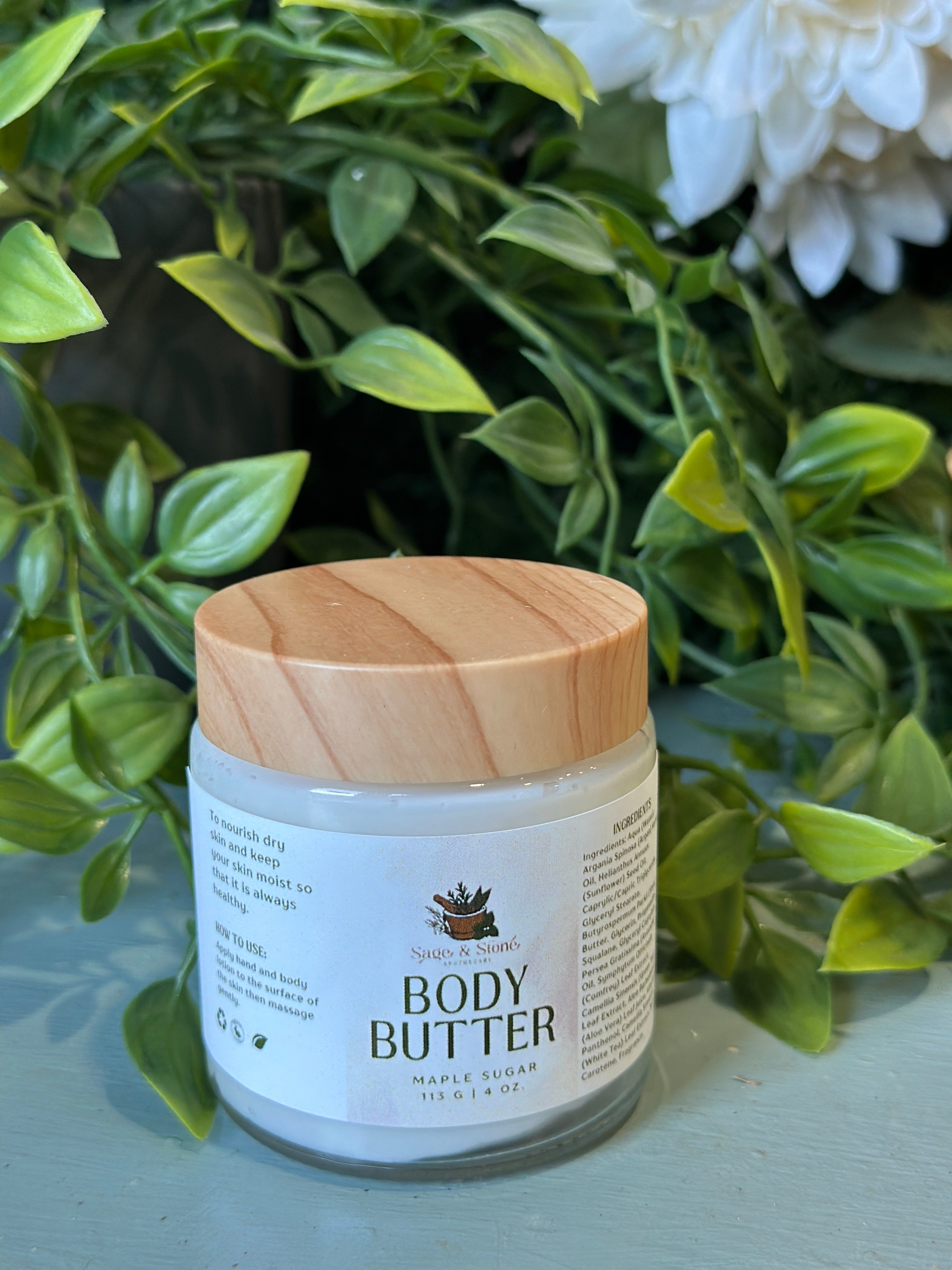 Luxurious Sage & Stone Apothecary Maple Sugar Body Butter jar with creamy texture and natural maple scent for nourishing skin.