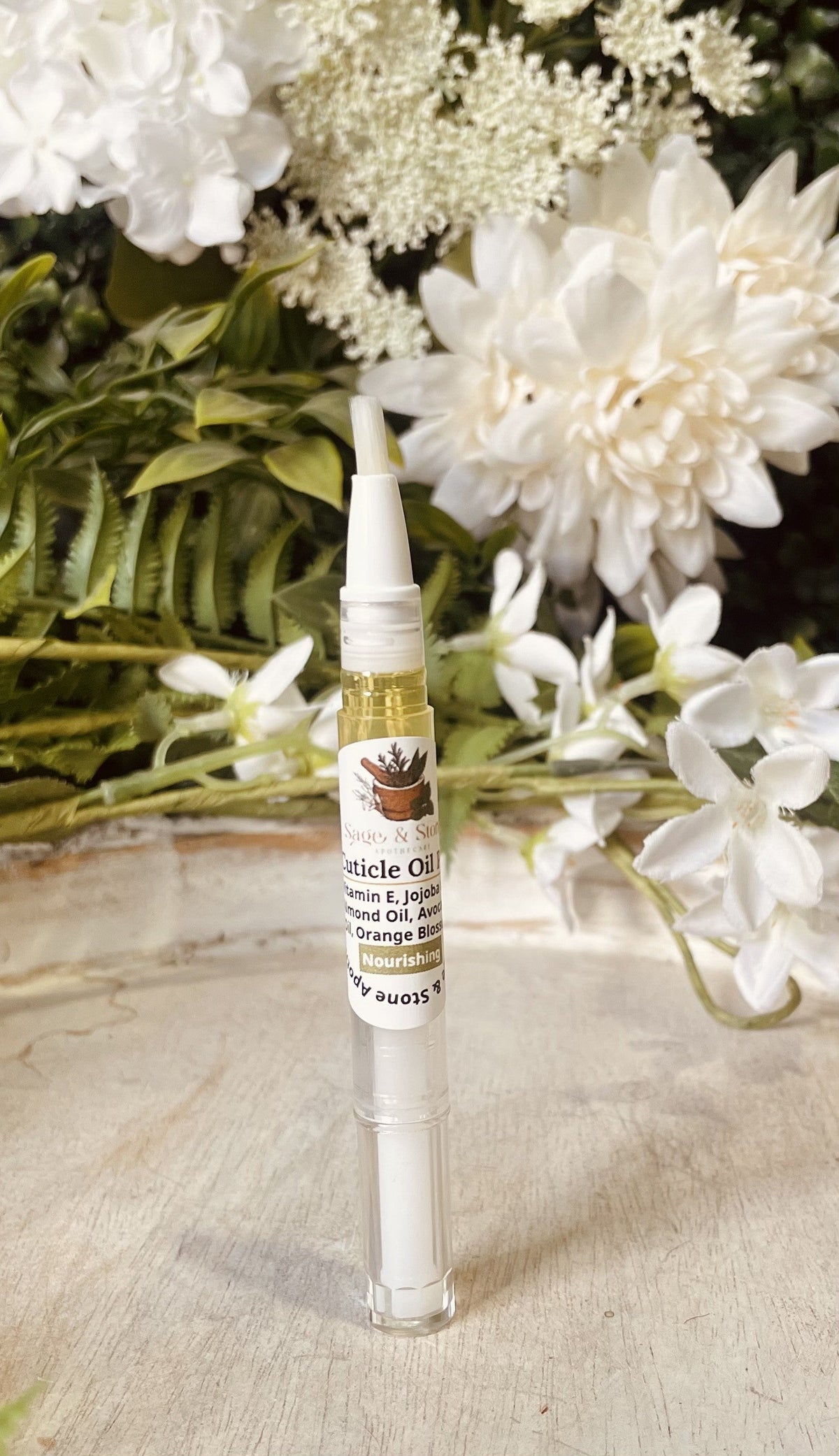 Sage & Stone Apothecary nourishing cuticle oil pen with a sleek white applicator for healthy, moisturized cuticles.
