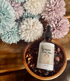 Rose Hip Facial Serum by Sage & Stone Apothecary, showing the amber glass bottle with a dropper cap on a white background.