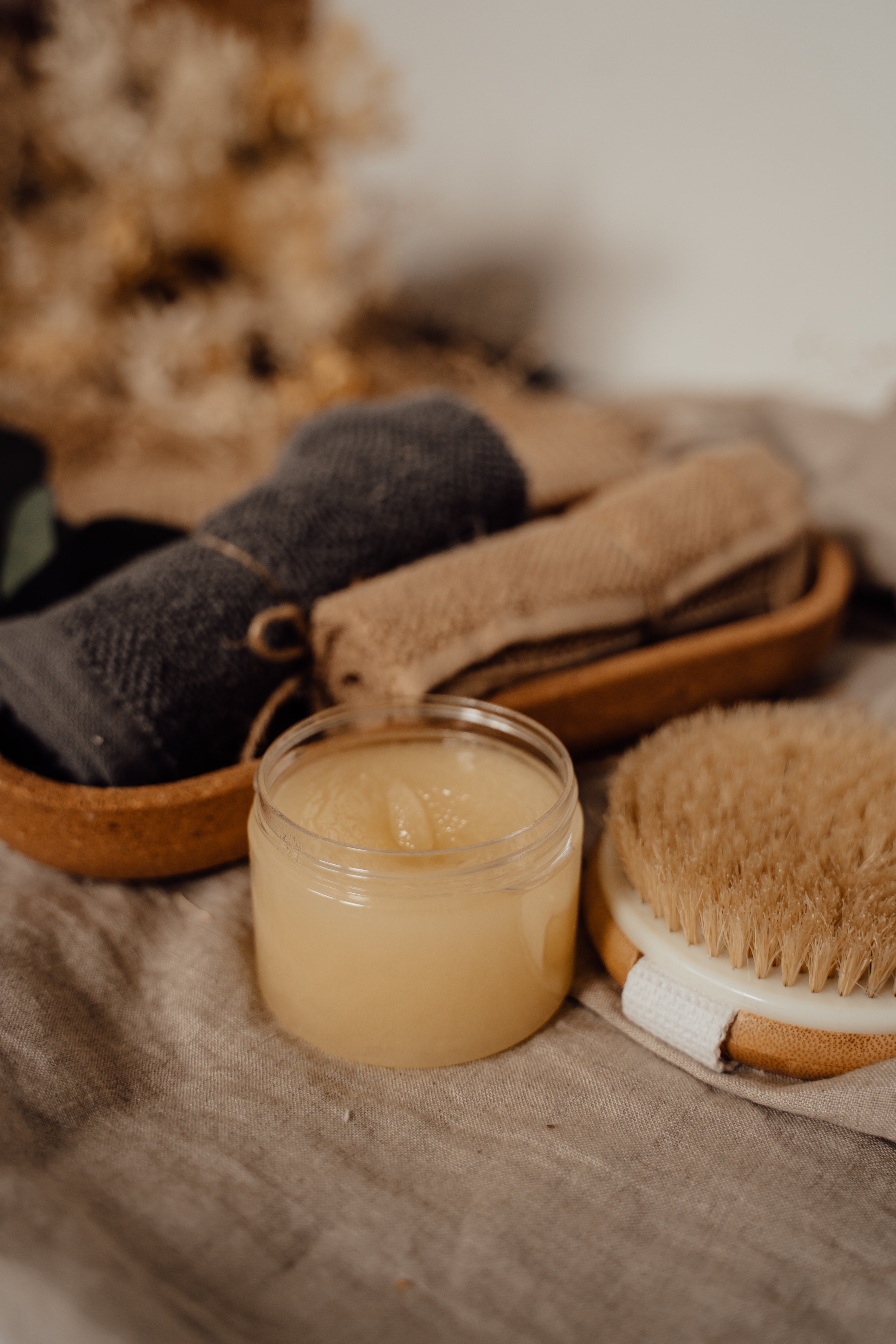 Brown sugar exfoliating body scrub by Sage & Stone Apothecary, showing a jar of textured brown sugar scrub with natural ingredients.