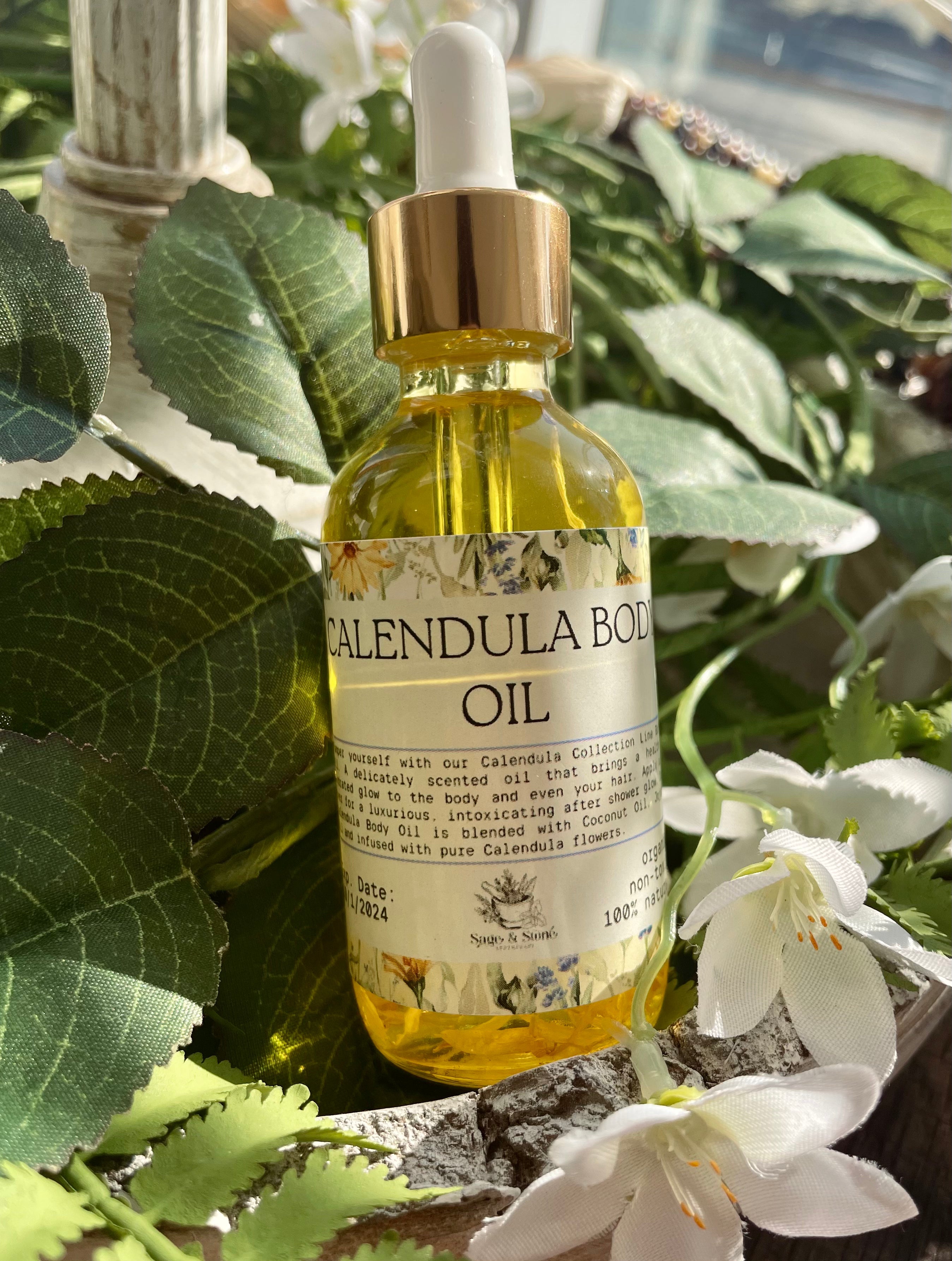 Sage & Stone Apothecary calendula body oil in a glass bottle with a dropper, featuring a natural, herbal appearance.