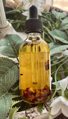 Sage & Stone Apothecary rose body oil bottle with a floral design, showcasing natural ingredients and elegant packaging.