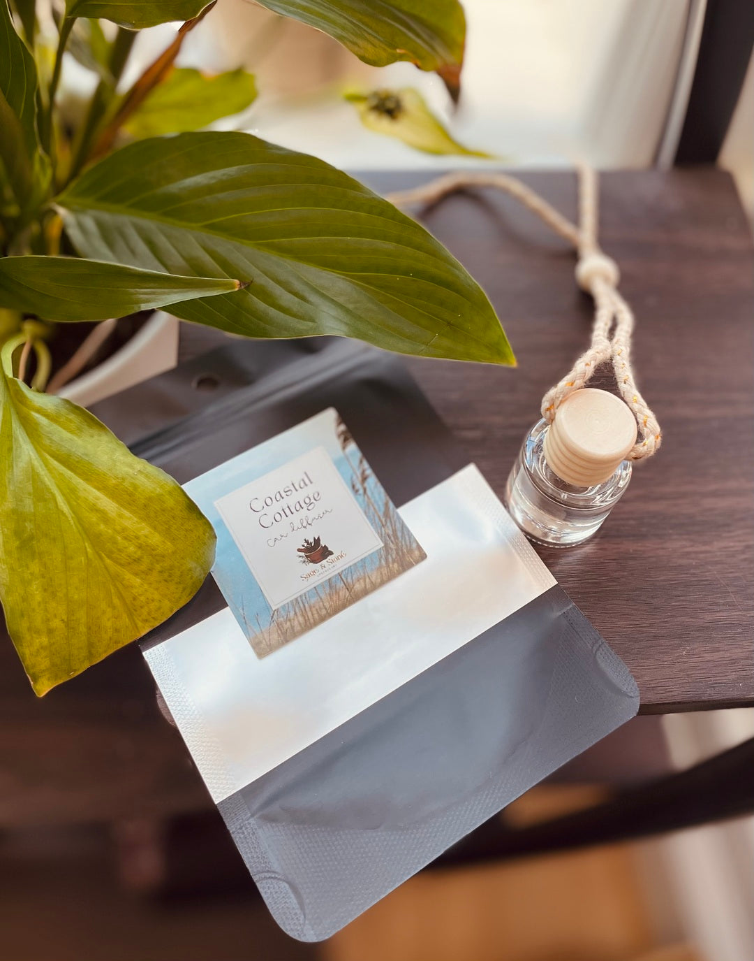 Sage & Stone Apothecary Coastal Cottage Car Diffuser with white ceramic and wooden accents, designed for essential oil diffusion.