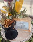 Sage & Stone Apothecary Abundance Simmer Pot Blend in a jar with dried herbs and spices for aromatic simmering.