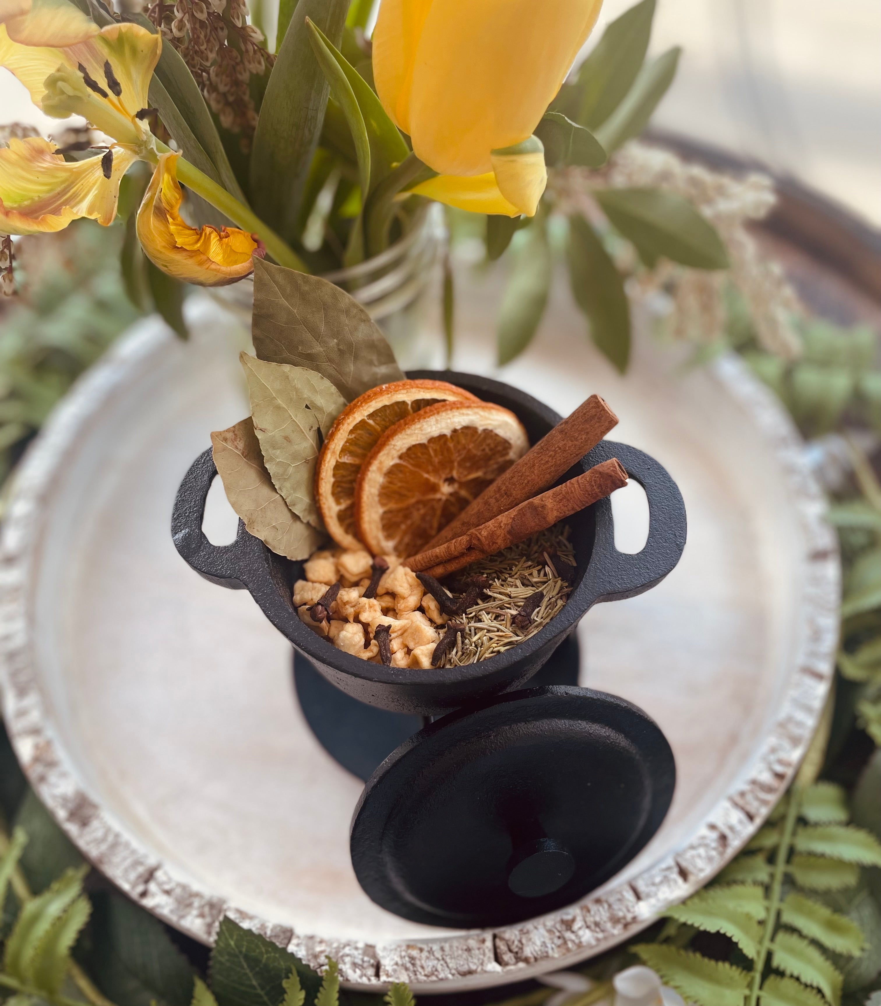 Sage & Stone Apothecary Abundance Simmer Pot Blend with dried herbs and spices in a jar, ready for aromatic simmering.