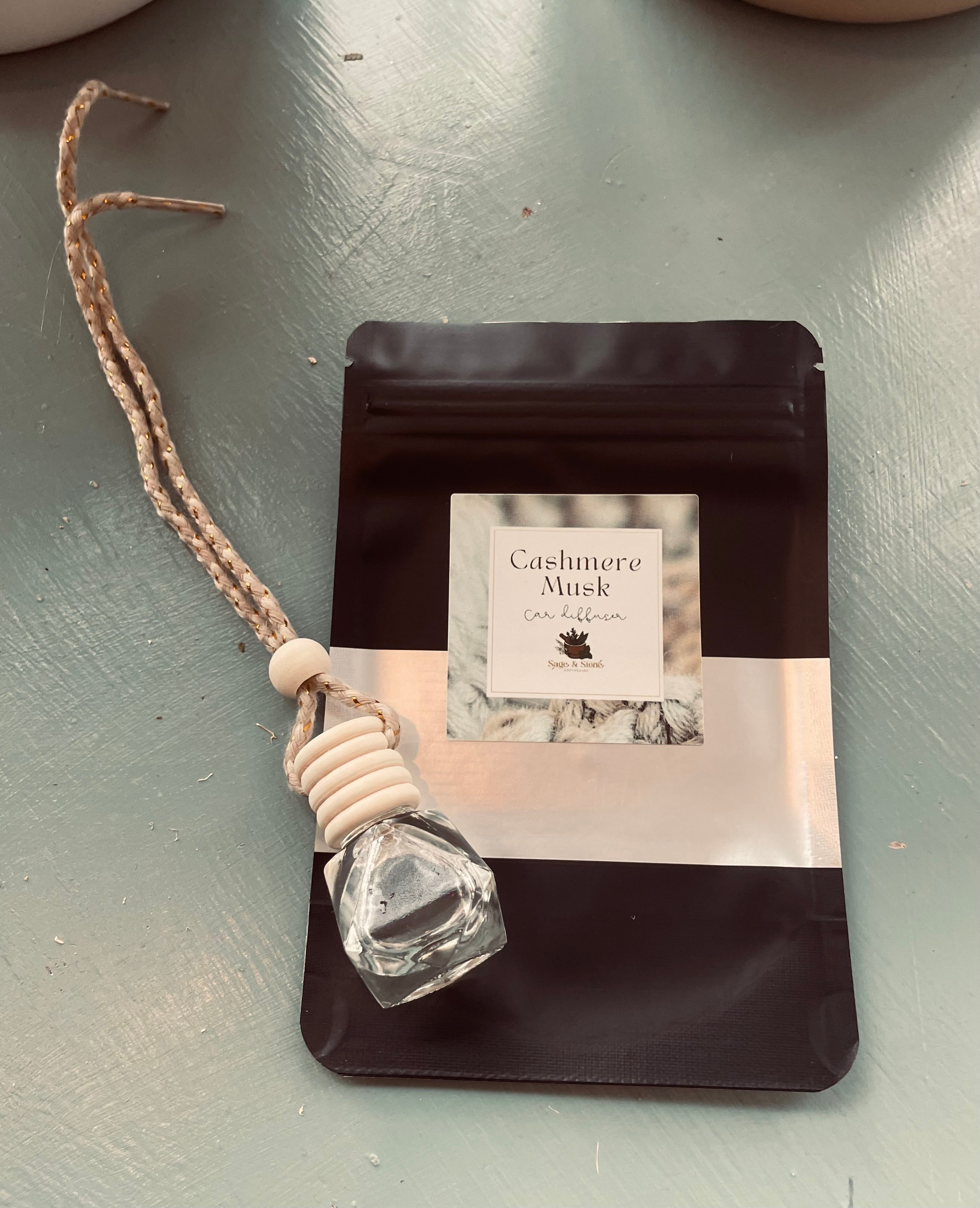 Sage & Stone Apothecary Cashmere Musk hanging car diffuser with a sleek design and natural scent display