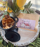 Sage & Stone Apothecary Cozy Home Simmer Pot Blend in a clear jar with herbs and spices, ready for simmering to create a warm home aroma.