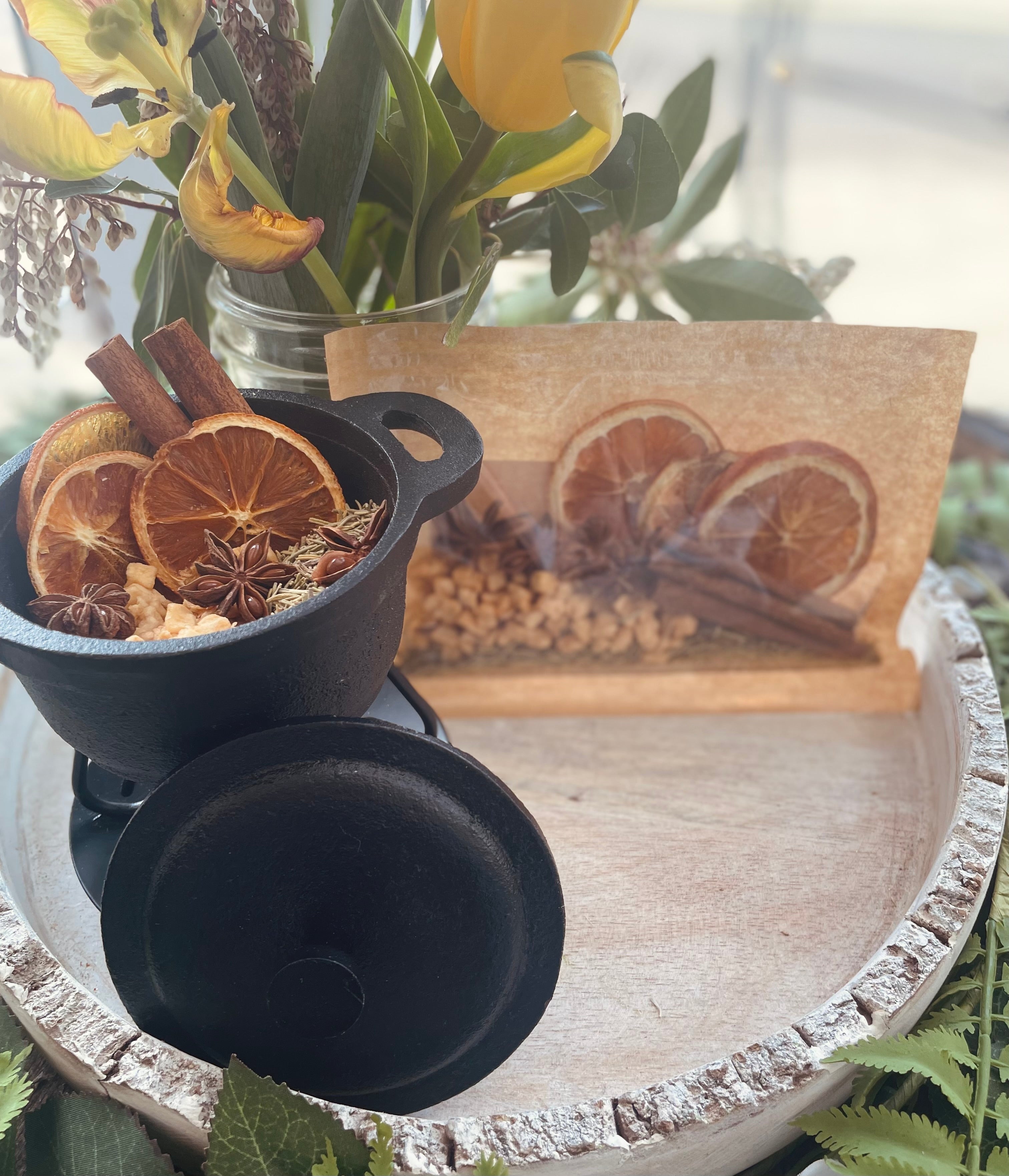 Sage & Stone Apothecary Cozy Home Simmer Pot Blend with dried herbs and spices in a glass jar on a rustic wooden background