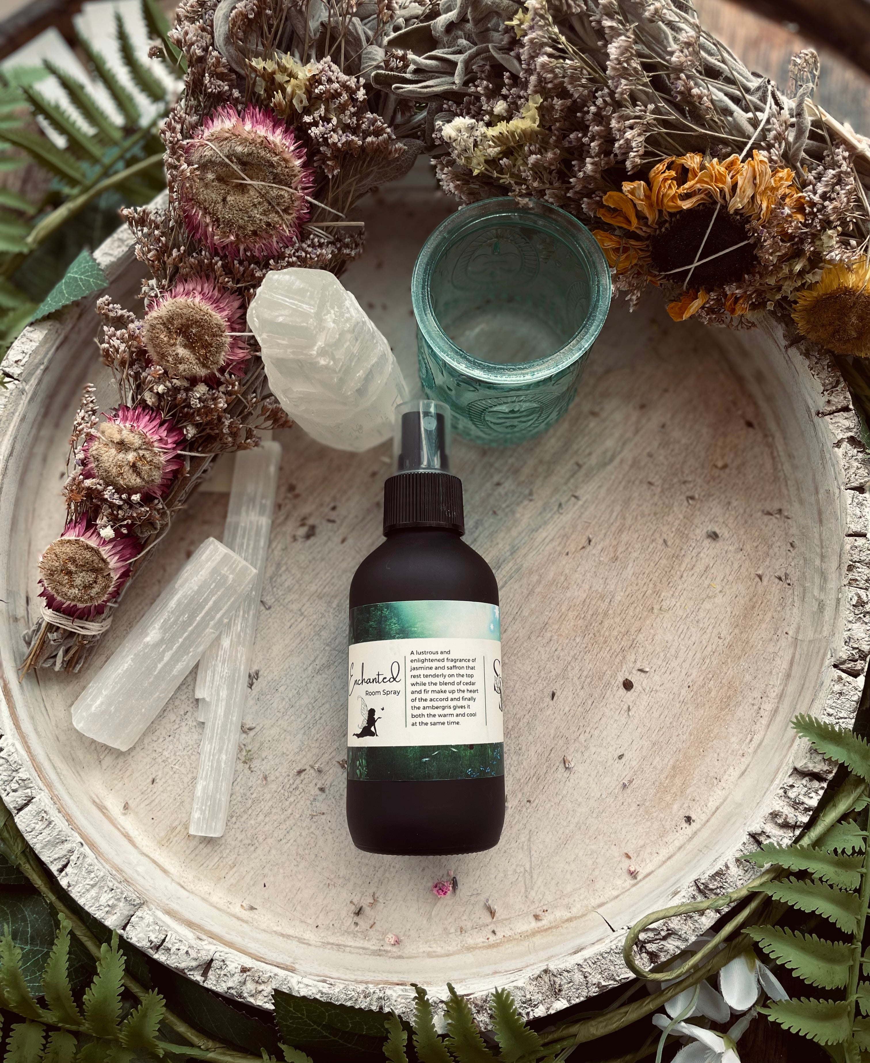 Sage & Stone Apothecary Enchanted Room Spray with botanical ingredients in a clear glass bottle with a spray nozzle
