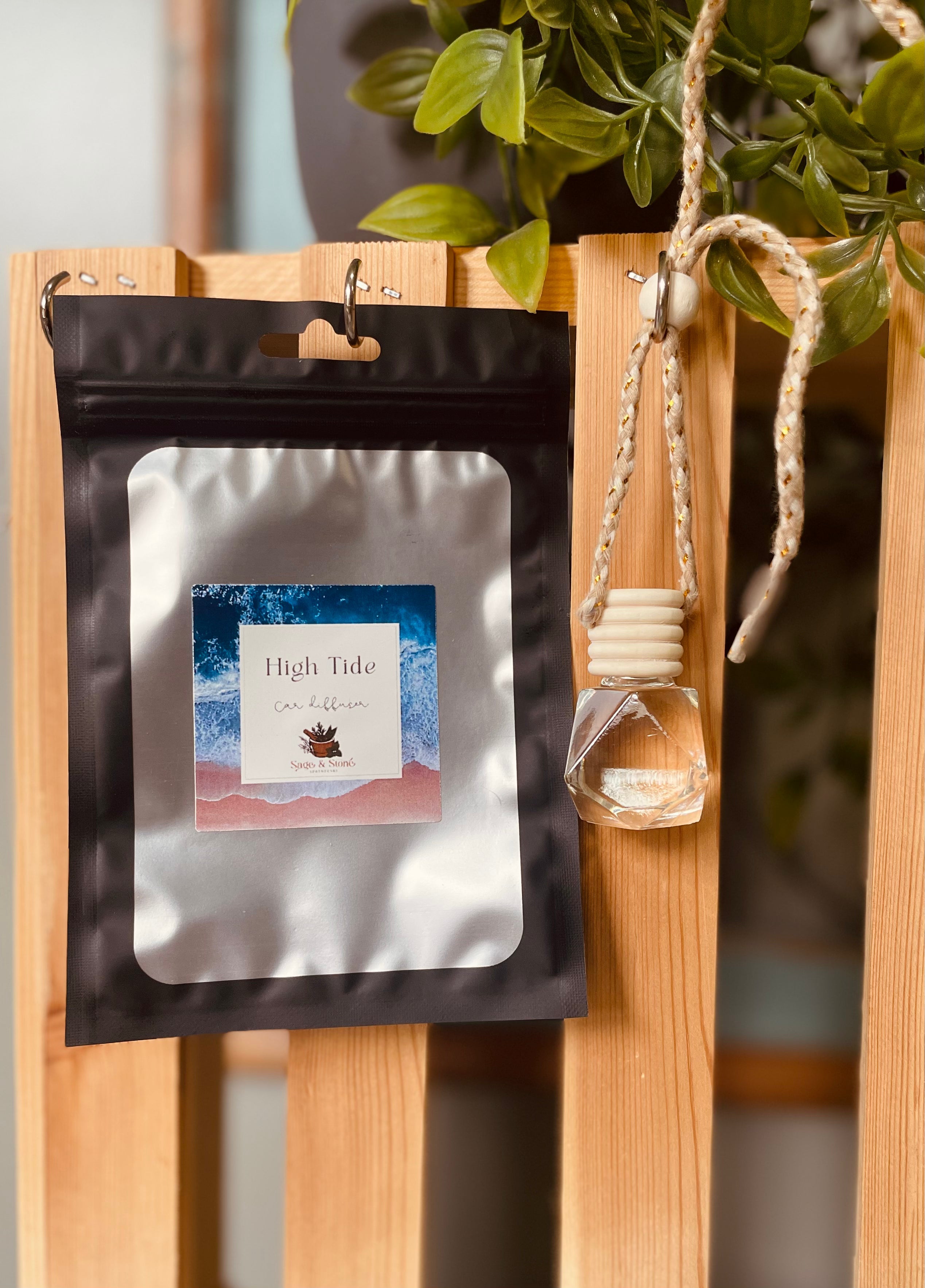 Sage & Stone Apothecary High Tide car diffuser with wooden and ceramic design, showing the diffuser in a car interior setting.