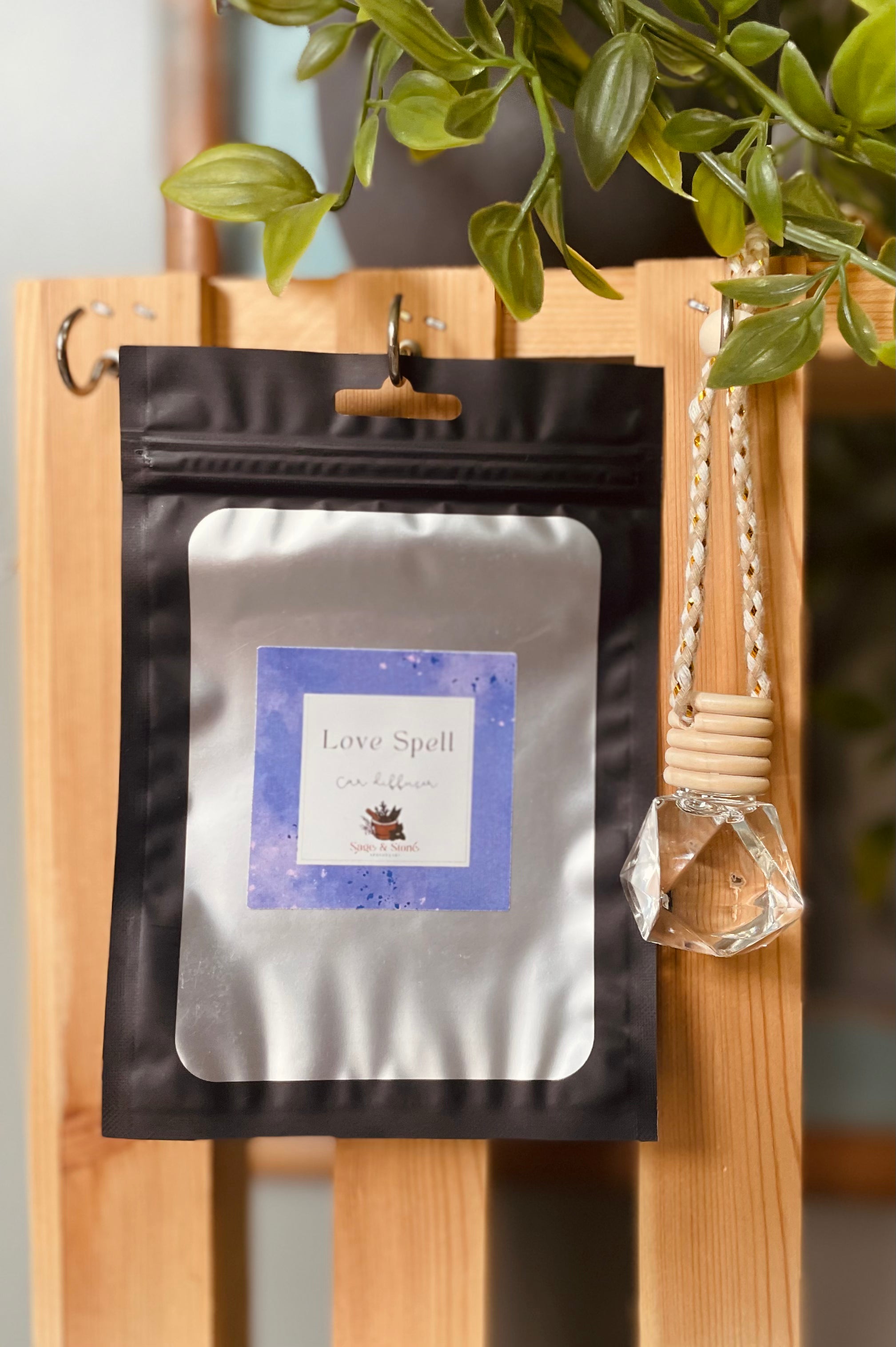Sage & Stone Apothecary Love Spell car diffuser with aromatic oil and decorative design for freshening vehicle air.