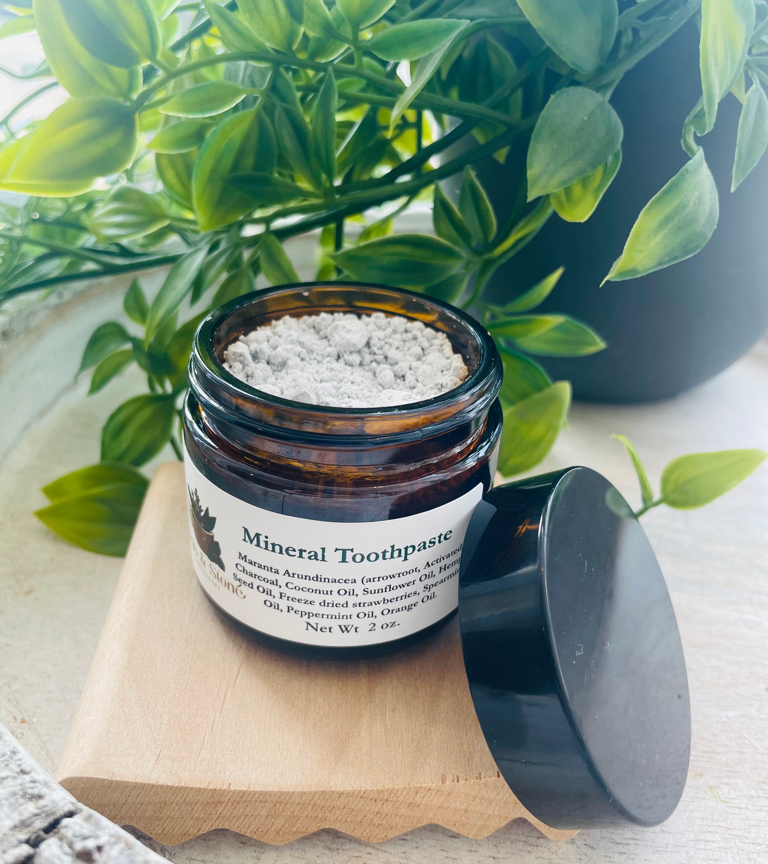 Sage & Stone Apothecary mineral toothpaste tube with natural herbs and minerals, designed for healthy oral care.