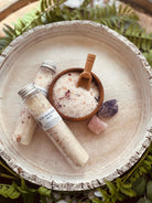 Sage & Stone Apothecary Ruby Rose bath salt tubes with pink and white floral packaging on a white background.