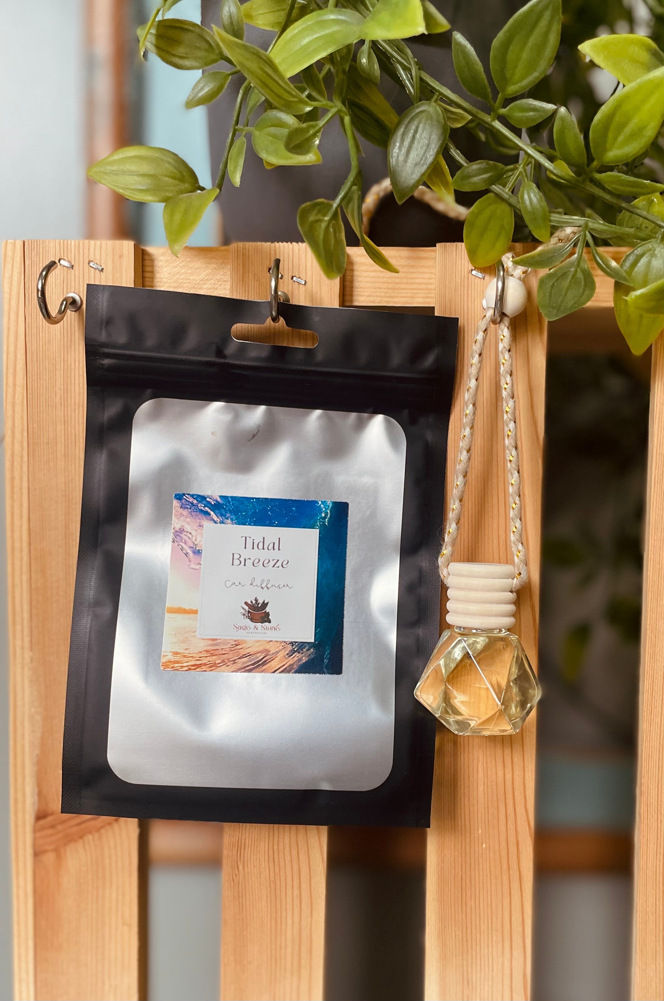 Sage & Stone Apothecary Tidal Breeze car diffuser with wooden and ceramic design, emitting calming aromatherapy vapor.