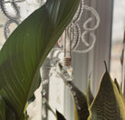Vanilla Orchid car diffuser from Sage & Stone Apothecary featuring a sleek design and aromatic vanilla orchid fragrance.