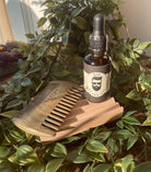 Men's RIP Beard Oil by Sage & Stone Apothecary, close-up of the dark glass bottle with dropper cap and label.