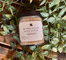 Brown Sugar Chamomile Scrub from Sage & Stone Apothecary, close-up of natural exfoliating scrub with brown sugar and chamomile flowers.