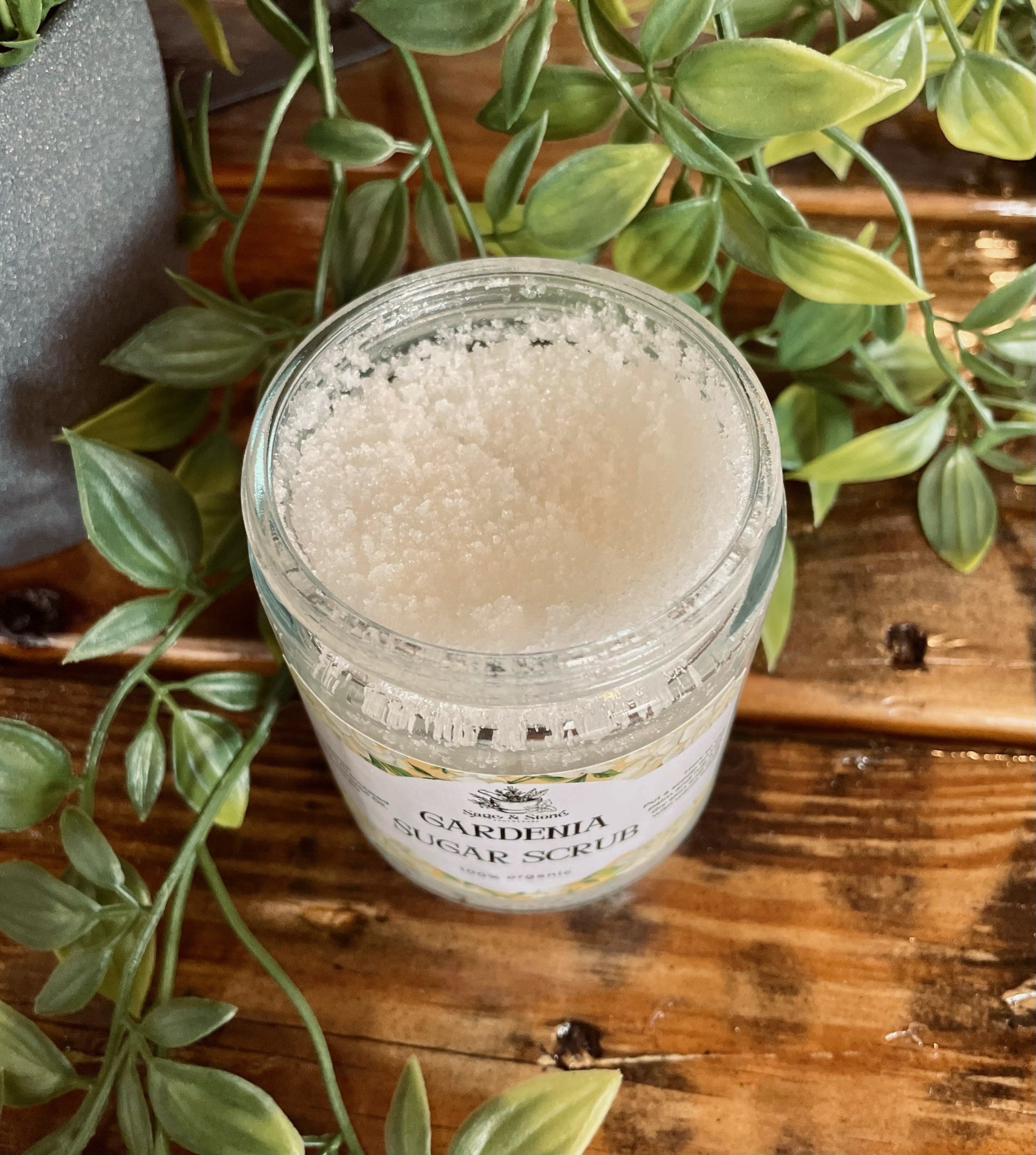 Sage & Stone Apothecary Gardenia Sugar Scrub in a jar, with natural ingredients and a floral scent for exfoliating and nourishing skin.