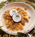 Calendula Salve by Sage & Stone Apothecary displayed in a jar, showcasing a natural herbal salve for personal care and skin wellness.