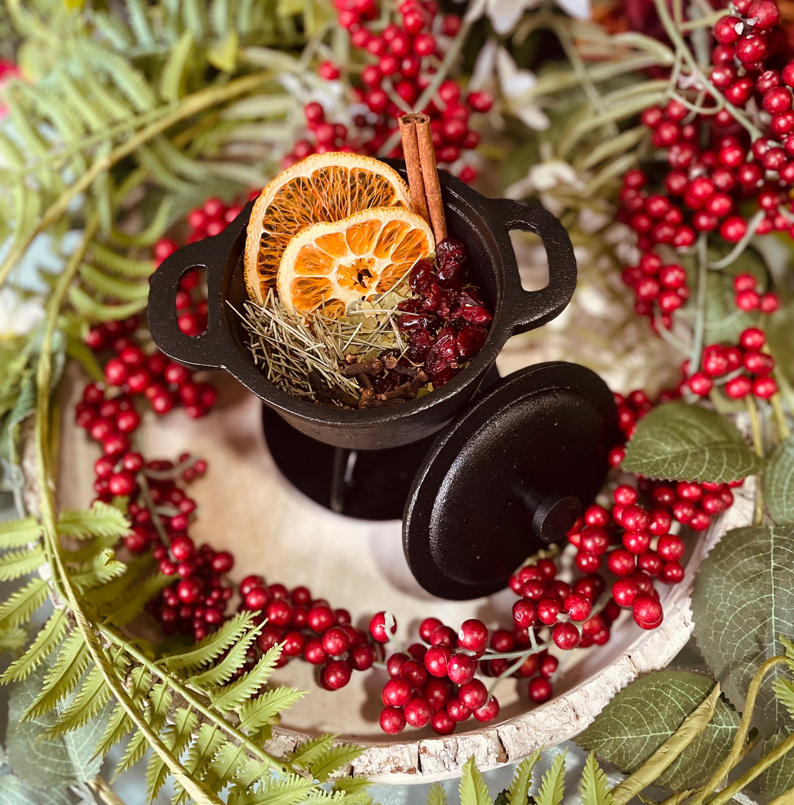 Winter Solstice Simmer Pot from Sage & Stone Apothecary with dried herbs, spices, and seasonal accents in a simmering pot.