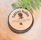 Sage & Stone Apothecary tattoo healing balm jar with natural ingredients, designed to soothe and care for fresh tattoos.