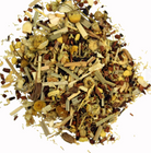 Chamomile Honey Vanilla tea from Sage & Stone Apothecary in a tea cup with fresh chamomile flowers and vanilla beans.