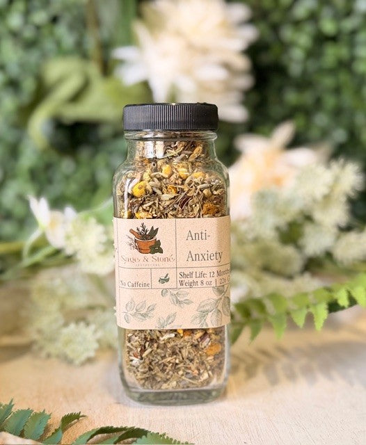 8 oz Sage & Stone Apothecary anti-anxiety herbal tea in a clear glass jar with a green label, showcasing the calming tea blend.