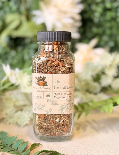 8 oz package of Calm the Fluff Down herbal tea by Sage & Stone Apothecary, featuring a calming blend in a tea bag.
