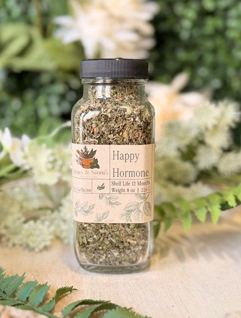 8 oz of Sage & Stone Apothecary Happy Hormone Balance Tea in a glass jar with a label, featuring a calming herbal blend.