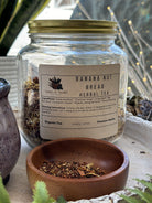 Sage & Stone Apothecary Banana Nut Bread flavored tea in a teacup with banana slices and nuts for a cozy, inviting presentation