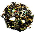 Cup of peppermint white chocolate tea by Sage & Stone Apothecary, showcasing a steaming mug with peppermint and white chocolate flavors.