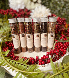 Assorted cozy winter teas from Sage & Stone Apothecary in a sampler box, featuring a variety of herbal and floral tea blends.