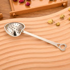 Heart-shaped tea infuser from Sage & Stone Apothecary, perfect for brewing loose leaf tea in a kitchen or as a gift.