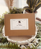 Assorted tea and infusion sampler set from Sage & Stone Apothecary, featuring herbal teas in decorative packaging.