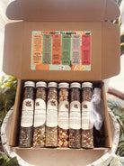 Sage & Stone Apothecary tea sampler set with assorted herbal teas and infusions in a decorative box for gift-giving.