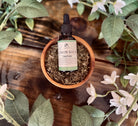 Sage & Stone Apothecary Lemon Balm Tincture 1 oz bottle, amber glass with dropper cap, herbal tincture for calming and relaxation.
