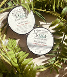 Lemongrass and eucalyptus healing balm jar from Sage & Stone Apothecary, with herbal ingredients and natural wellness packaging.