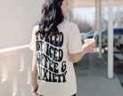 Black graphic tee featuring "Fueled by iced coffee and anxiety" text, casual fit, from Shop Karma Tees.