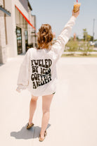 Graphic tee featuring "Fueled by iced coffee and anxiety" with bold text, casual fit, from Shop Karma Tees.