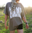 Mama Checkered Graphic Tee by Shop Karma Tees featuring a stylish black and white checkered design on soft cotton fabric.